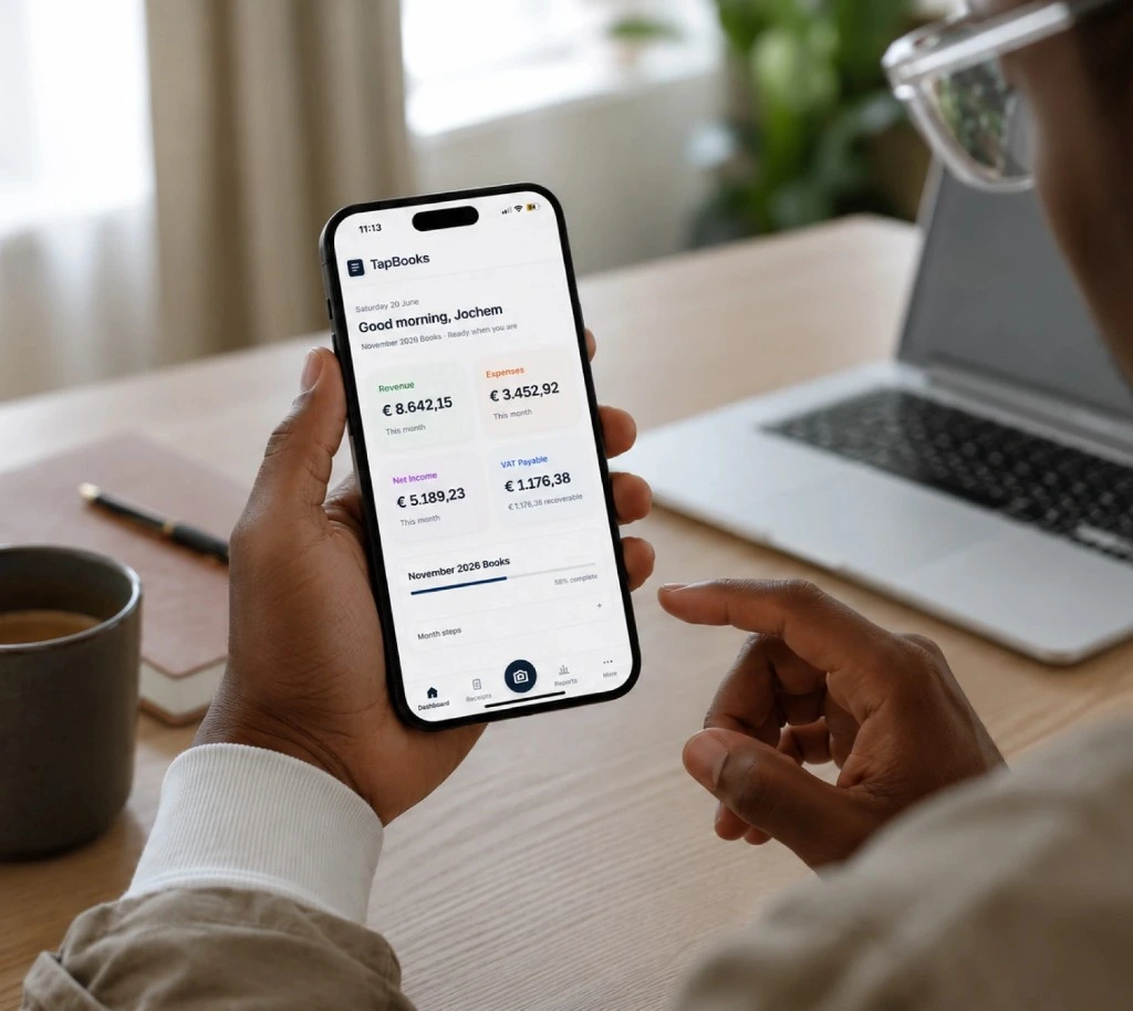 Business owner reviewing bookkeeping on the TapBooks mobile app